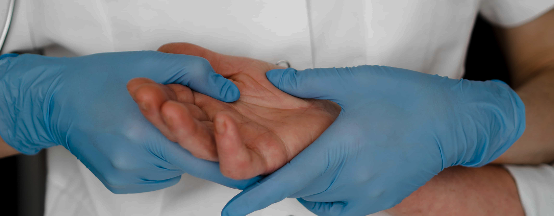 Essential Tremor surgery consultation, where a doctor consults with a patient in a hospital setting.