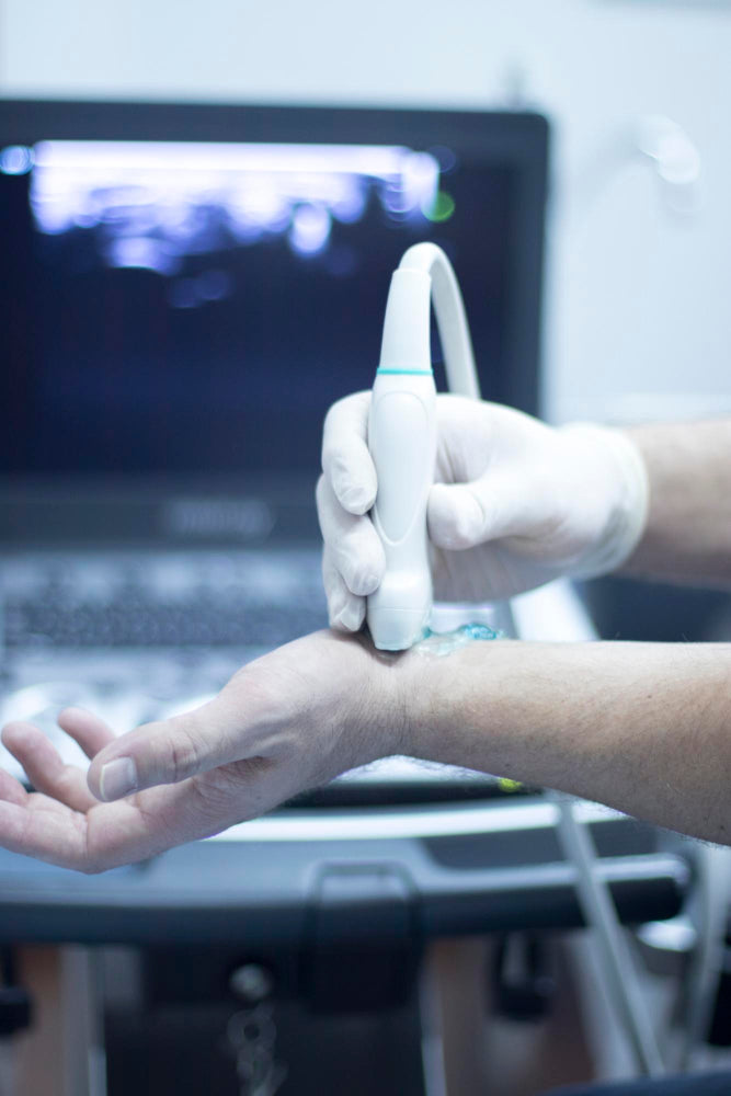 DBS vs focused ultrasound shows a hand interacting with medical equipment in a hospital.