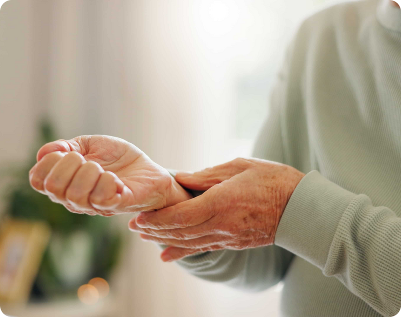 An essential tremor patient listening to the doctor explain deep-brain stimulation treatment options.